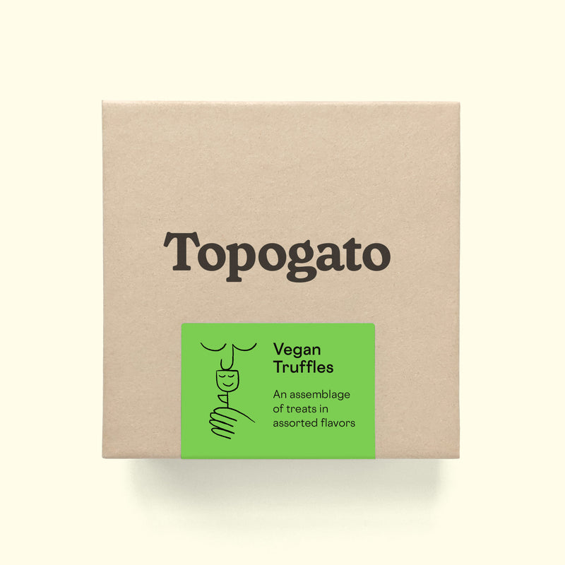 A truffle box with a logo of online chocolate company Topogato shown from the top down. The chocolate gift box has a green label that details the contents of vegan chocolate truffles with a lively illustration of a person smelling a flower.